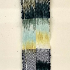 A long weaving using the painted warp technique